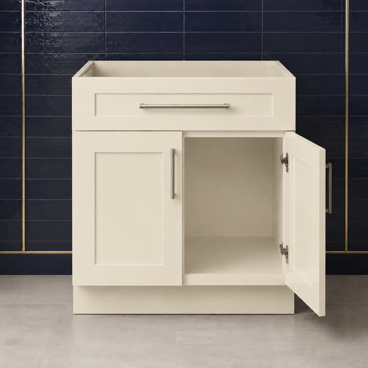 36 inch sink base cabinet showing double doors below a false drawer panel, all-wood frame sized for undermount or drop-in sinks, in Seashell Cream finish — front view