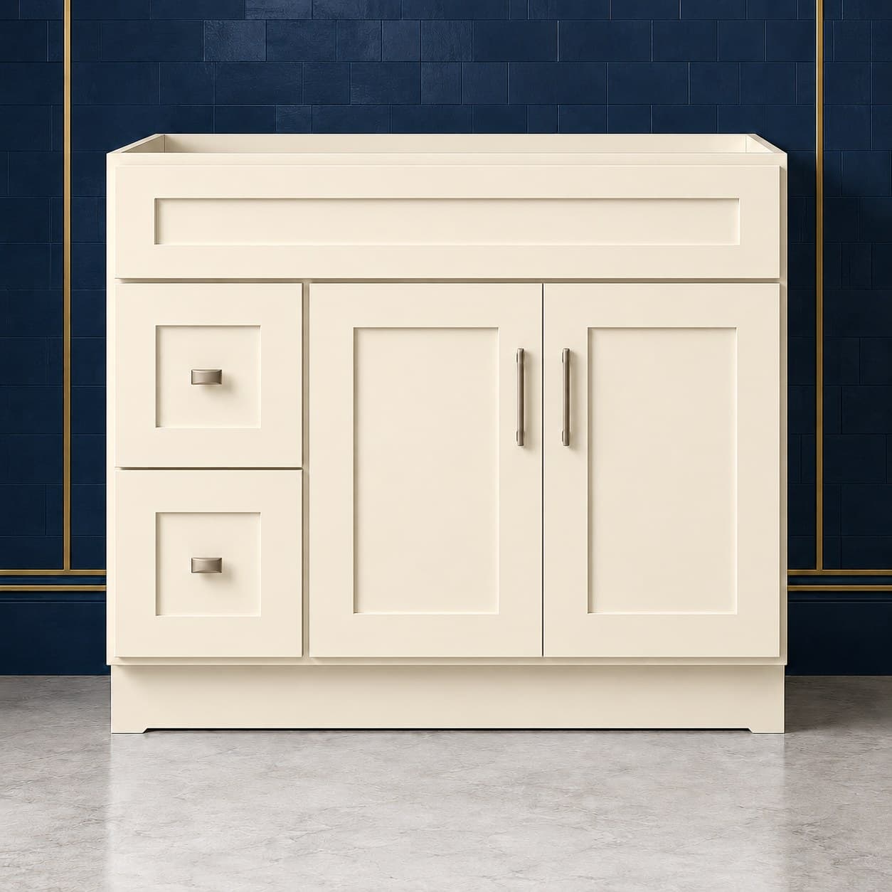 42-inch wide vanity sink base cabinet with a left-side two-drawer stack beside two shaker-style doors topped by a false drawer front, neutral finish, in Seashell Cream finish — front view