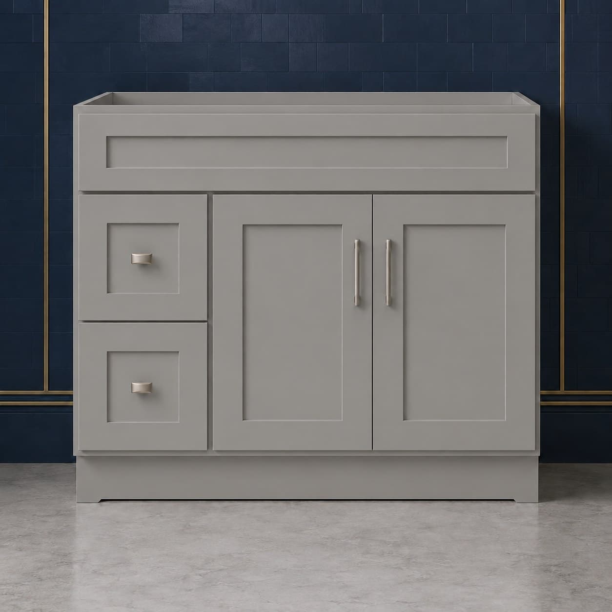 42-inch wide vanity sink base cabinet with a left-side two-drawer stack beside two shaker-style doors topped by a false drawer front, neutral finish, in Victory Gray finish — front view
